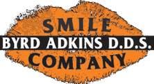 Orange and gray logo of dental services provider Byrd Adkins D.D.S. Smile Company in Amarillo, TX